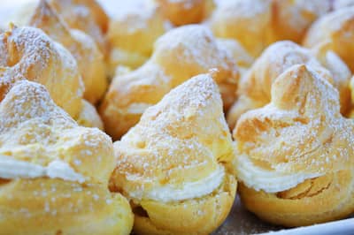 Cream-filled choux puffs dusted with icing sugar