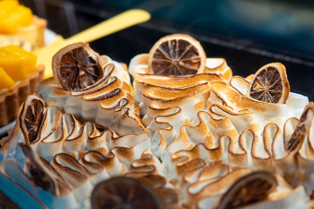 Torched Italian meringue peaks on a tart