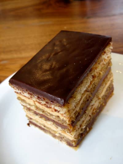 A classic opera cake slice showing its thin, even layers