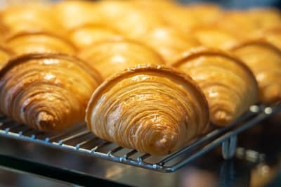 Pastries baking in the warm glow of a hot oven