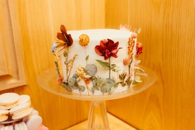 Delicate white sugar-paste flowers on a celebration cake