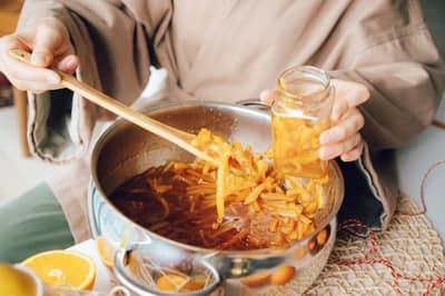Fruit jam bubbling in a pot as the pectin sets